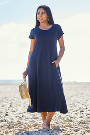 Model Eshan wearing size 10 of the Seamingly Good Dress – Truenavy in colour Truenavy, from the front