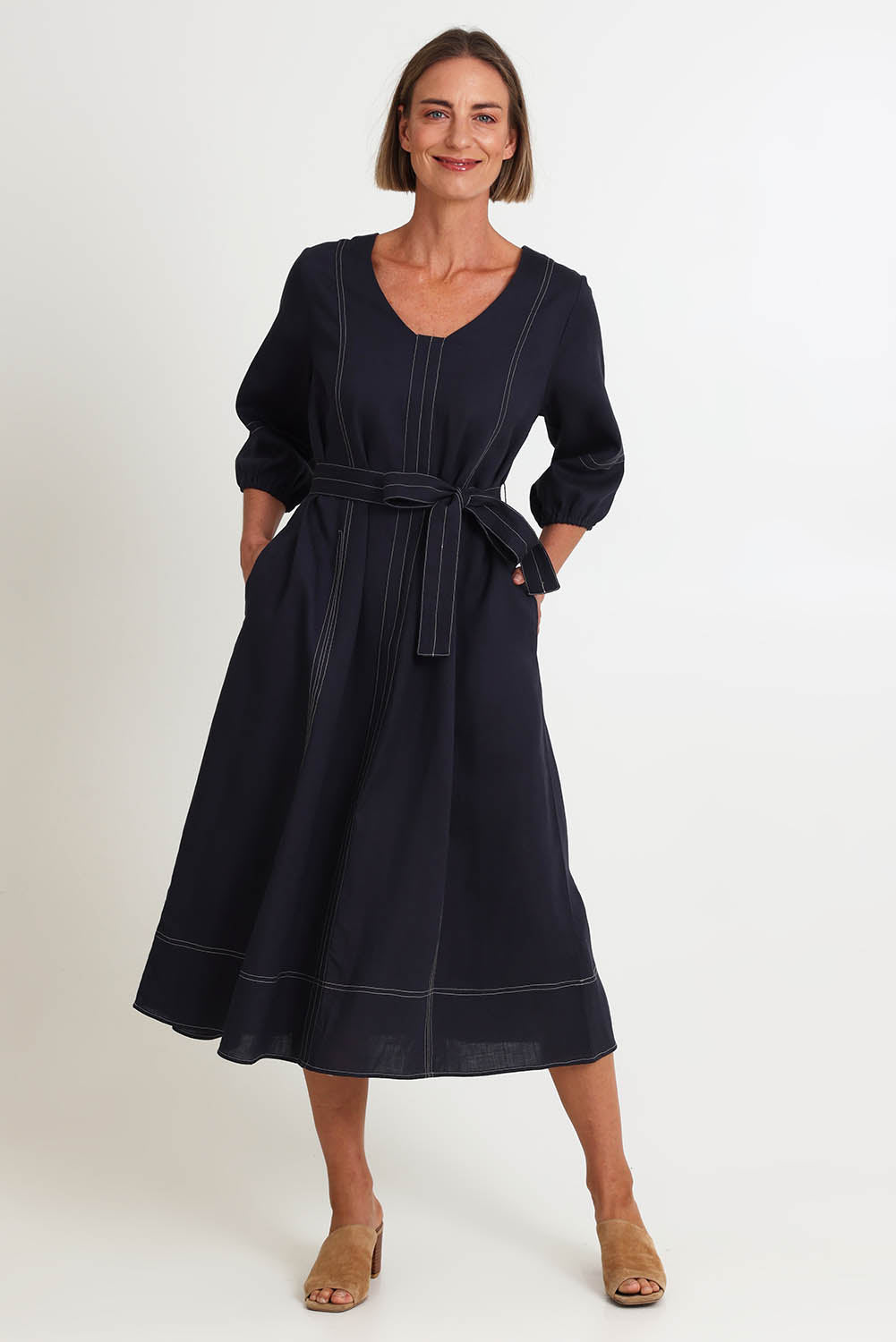 Model Riinar wearing size 10 of the Shout Out Dress – Gunsmoke in colour Gunsmoke, from the front
