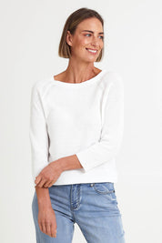 Model Riinar wearing size 10 of the Loop Me In Sweater – Vanilla in colour Vanilla, in a cropped view