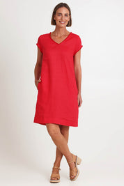 Model Riinar wearing size 10 of the V Festival Dress – Melon in colour Melon, from the front