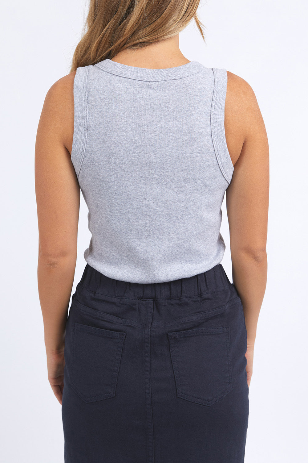A model wearing the Esme Cotton Tank in colour Greymarle (Grey), from the front, cropped image