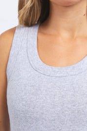 A model wearing the Esme Cotton Tank in colour Greymarle (Grey), from the front, cropped image