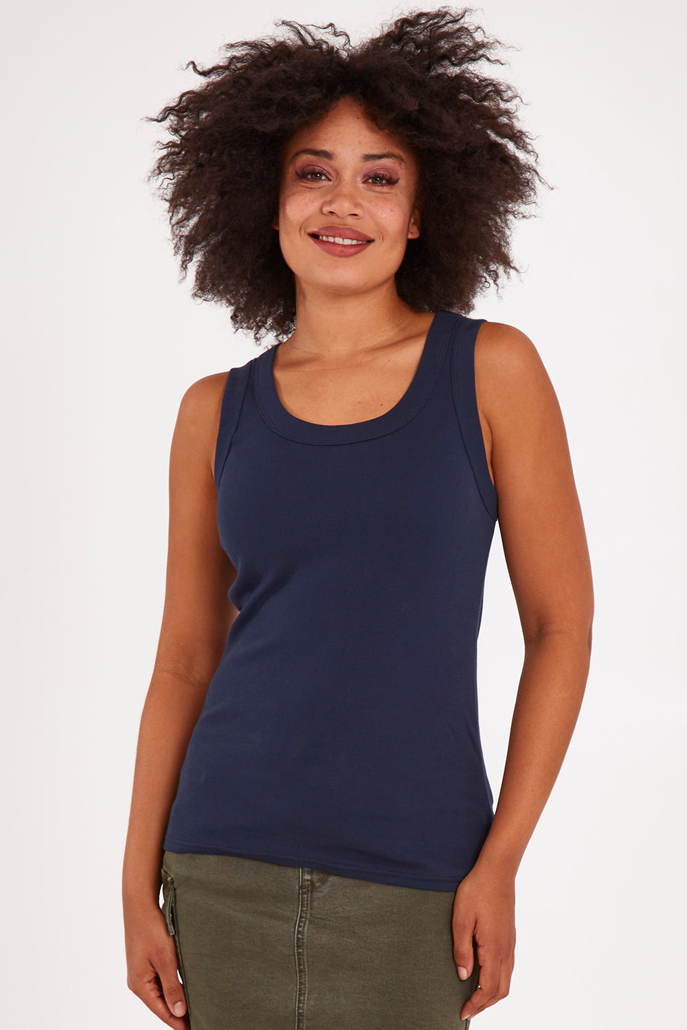 Model Olivia wearing size 10 of the Esme Cotton Tank in colour Sapphire (Blue), from the front, cropped image