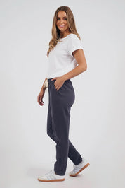 A model wearing the Elements Monday Cotton Pant in colour Coal (Grey), from the front, showing the whole outfit