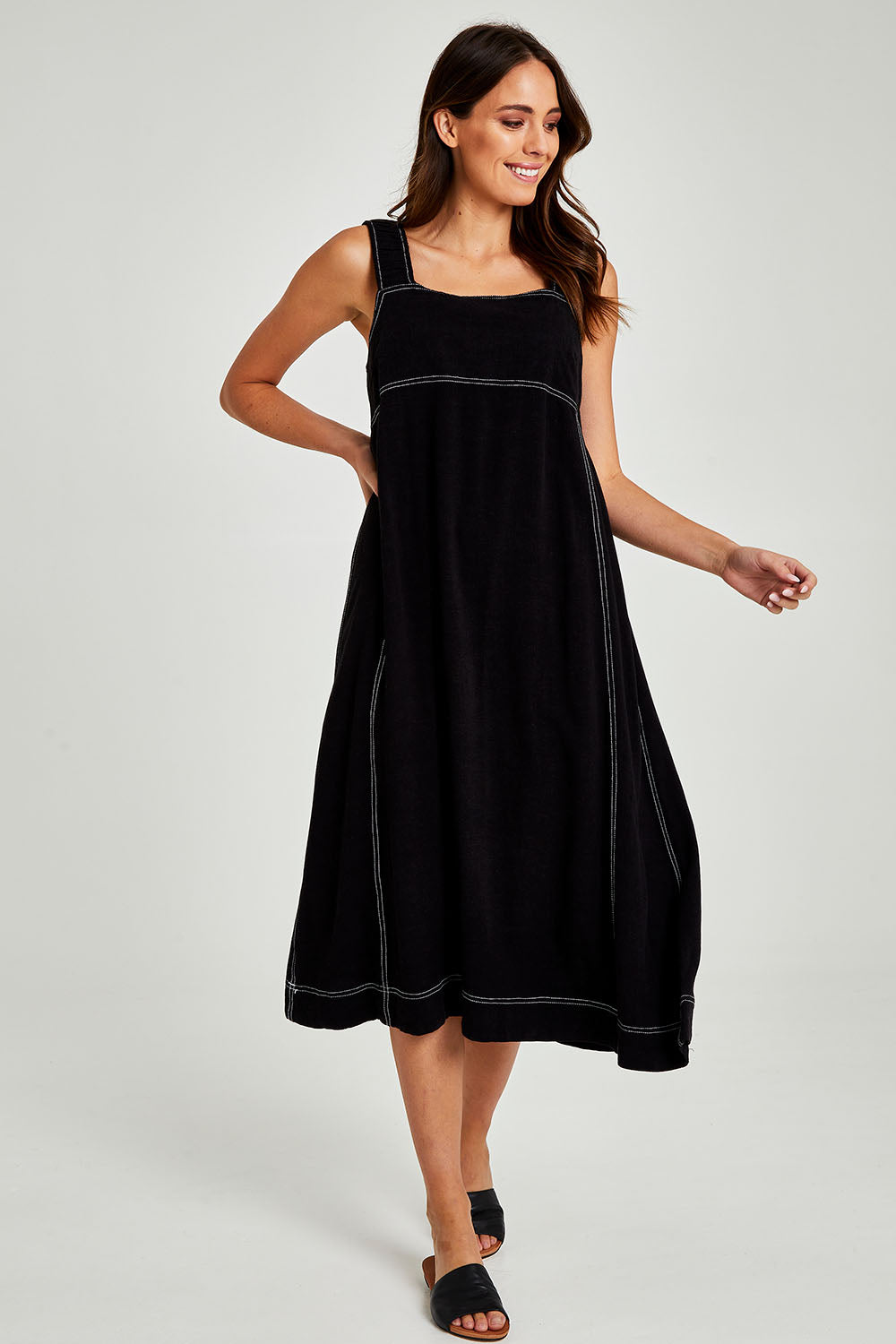 Model Madeline wearing size 10 of the Sage Dress in colour Black (Black), from the front, showing the whole outfit