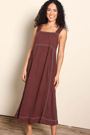 Model Pamelar wearing size 10 of the Sage Dress – Chocolate in colour Chocolate, from the front