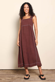 Model Pamelar wearing size 10 of the Sage Dress – Chocolate in colour Chocolate, from the front