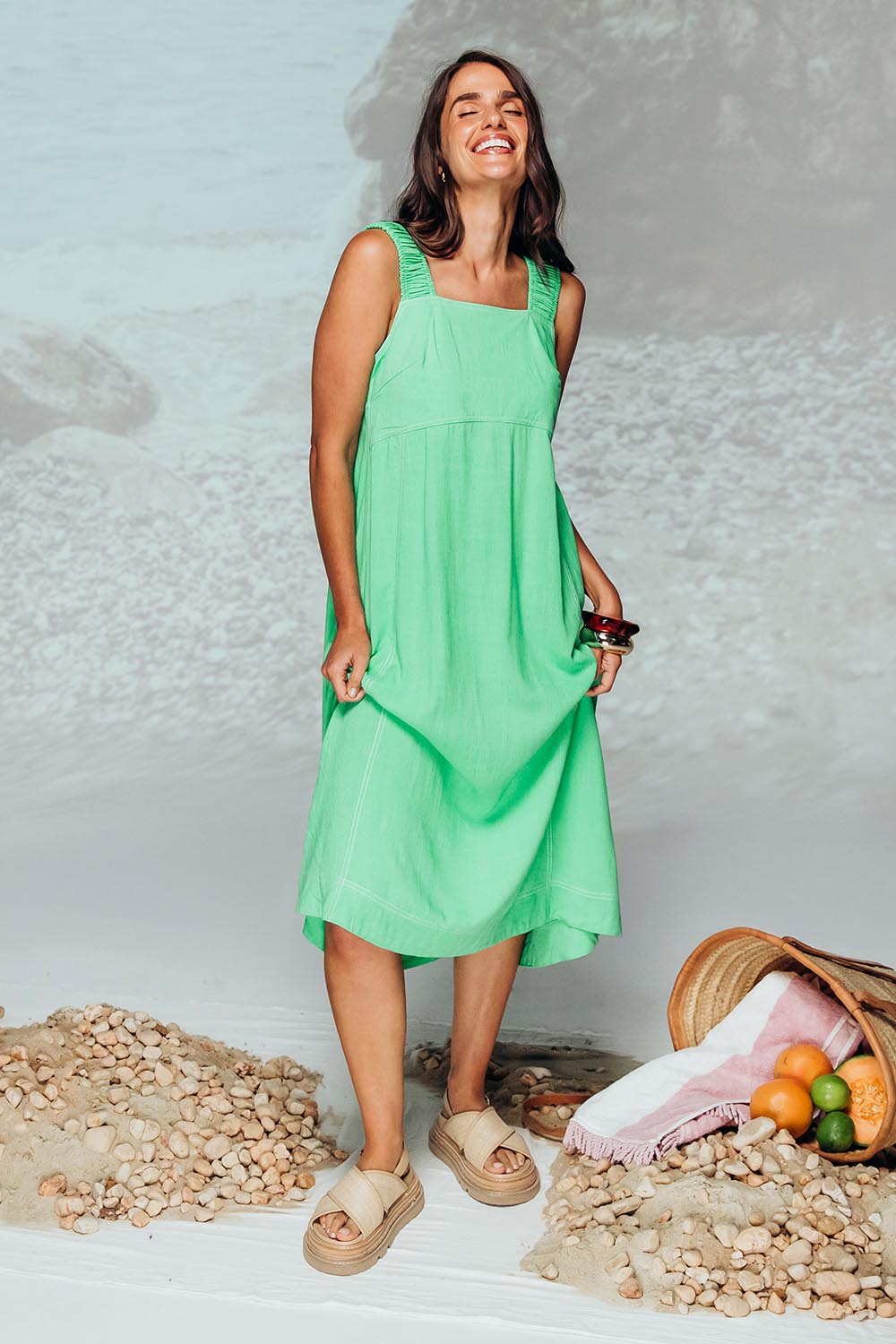 A model wearing the Sage Dress in colour Irishgreen (Green), from the front, showing the whole outfit
