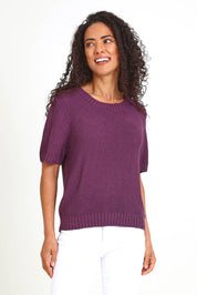 Model Pamelar wearing size 10 of the Blair Short Sleeve Knit – Plum in colour Plum, in a cropped view