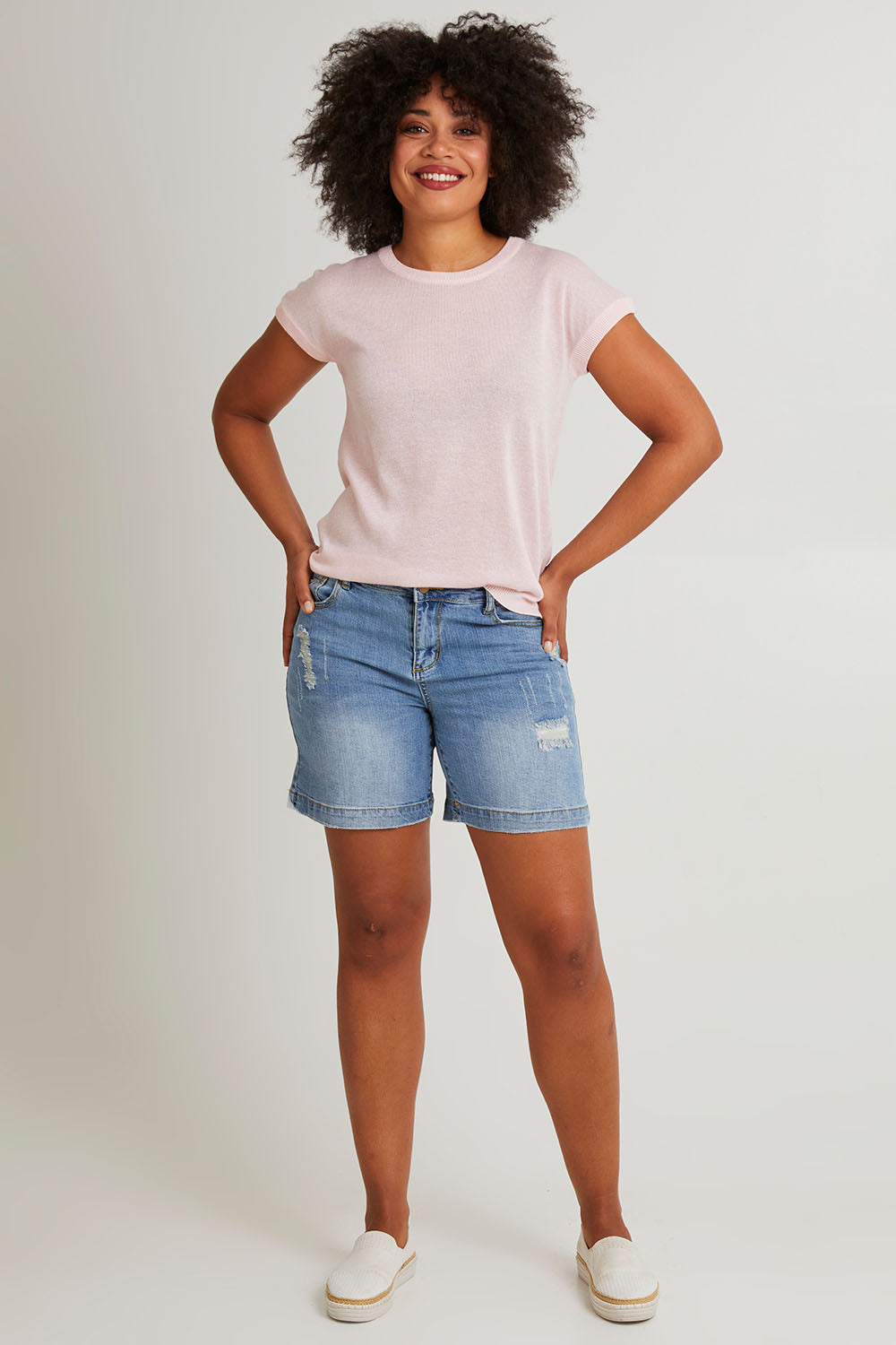 Model Olivia wearing size 10 of the Alma Metallic Knit in colour Barepink (Pink), from the front, showing the whole outfit