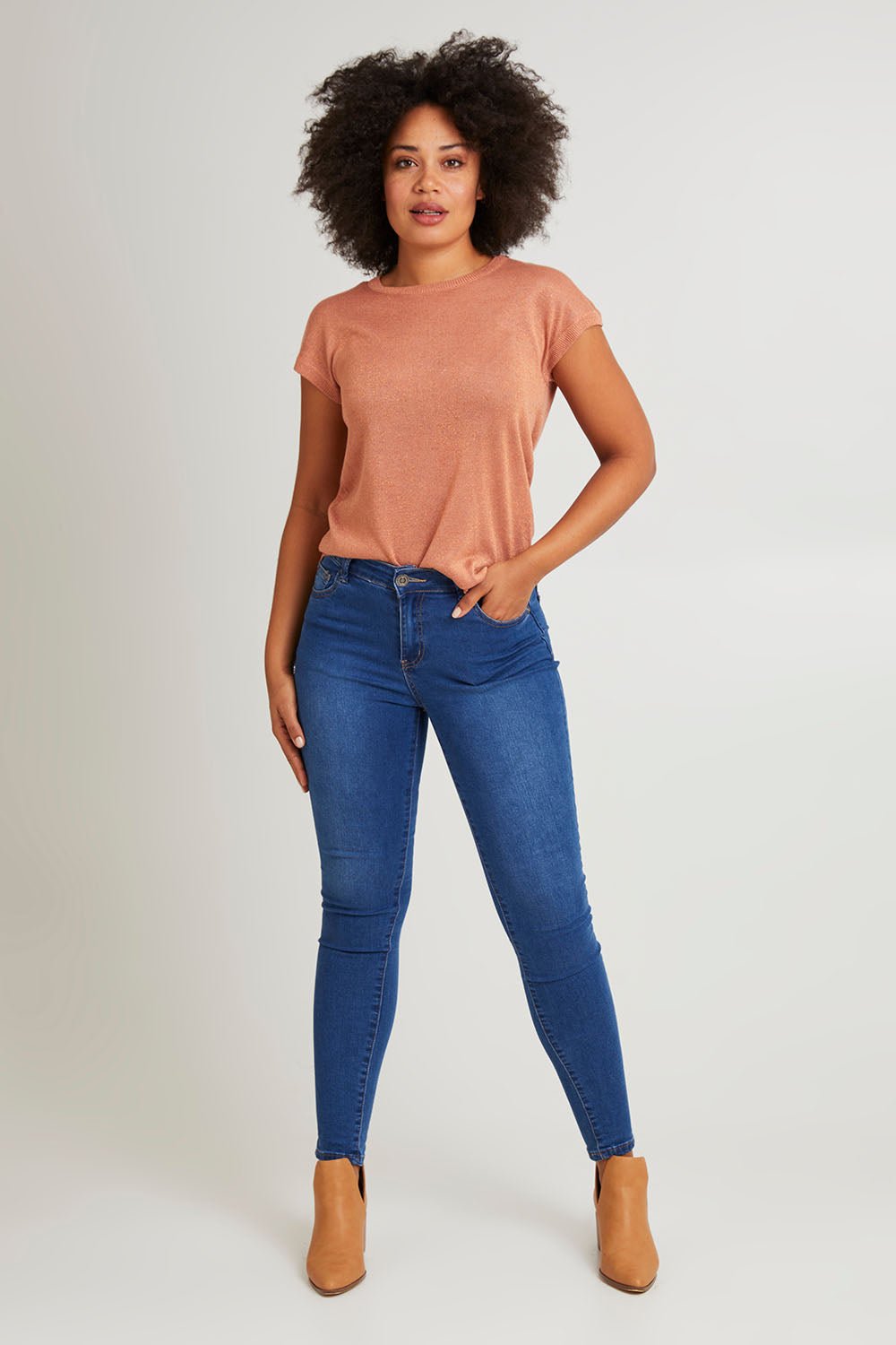 Model Olivia wearing size 10 of the Alma Metallic Knit in colour Clay, from the front, showing the whole outfit