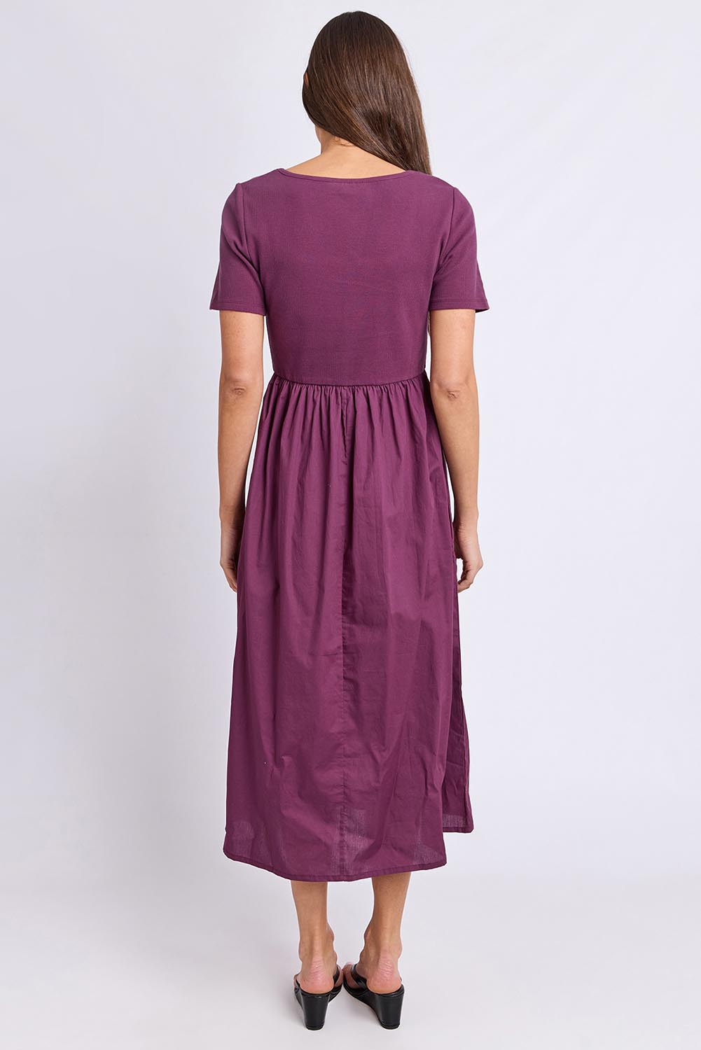 Model Genericm wearing size sample of the Ella Dress – Plum in colour Plum, from the front