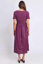 Model Genericm wearing size sample of the Ella Dress – Plum in colour Plum, from the front
