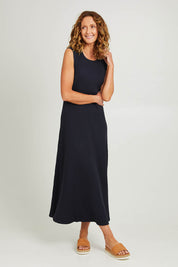 Model Emma wearing size 10 of the Pippa Rib Dress in colour Navy (Blue), from the front, showing the whole outfit