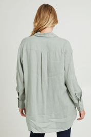 Model Grace wearing size 10 of the Sorrento Shirt in colour Sagegreen (Green), from the back