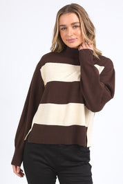 A model wearing the Canterbury Knit in colour Coffeevwhi, from the front, cropped image