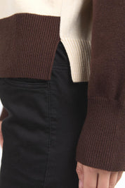 A model wearing the Canterbury Knit in colour Coffeevwhi, from the front, cropped image