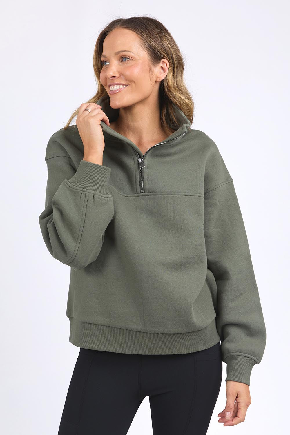 A model wearing the Elements College Zip Crew in colour Khaki (Green), from the front, cropped image