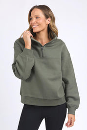 A model wearing the Elements College Zip Crew in colour Khaki (Green), from the front, cropped image