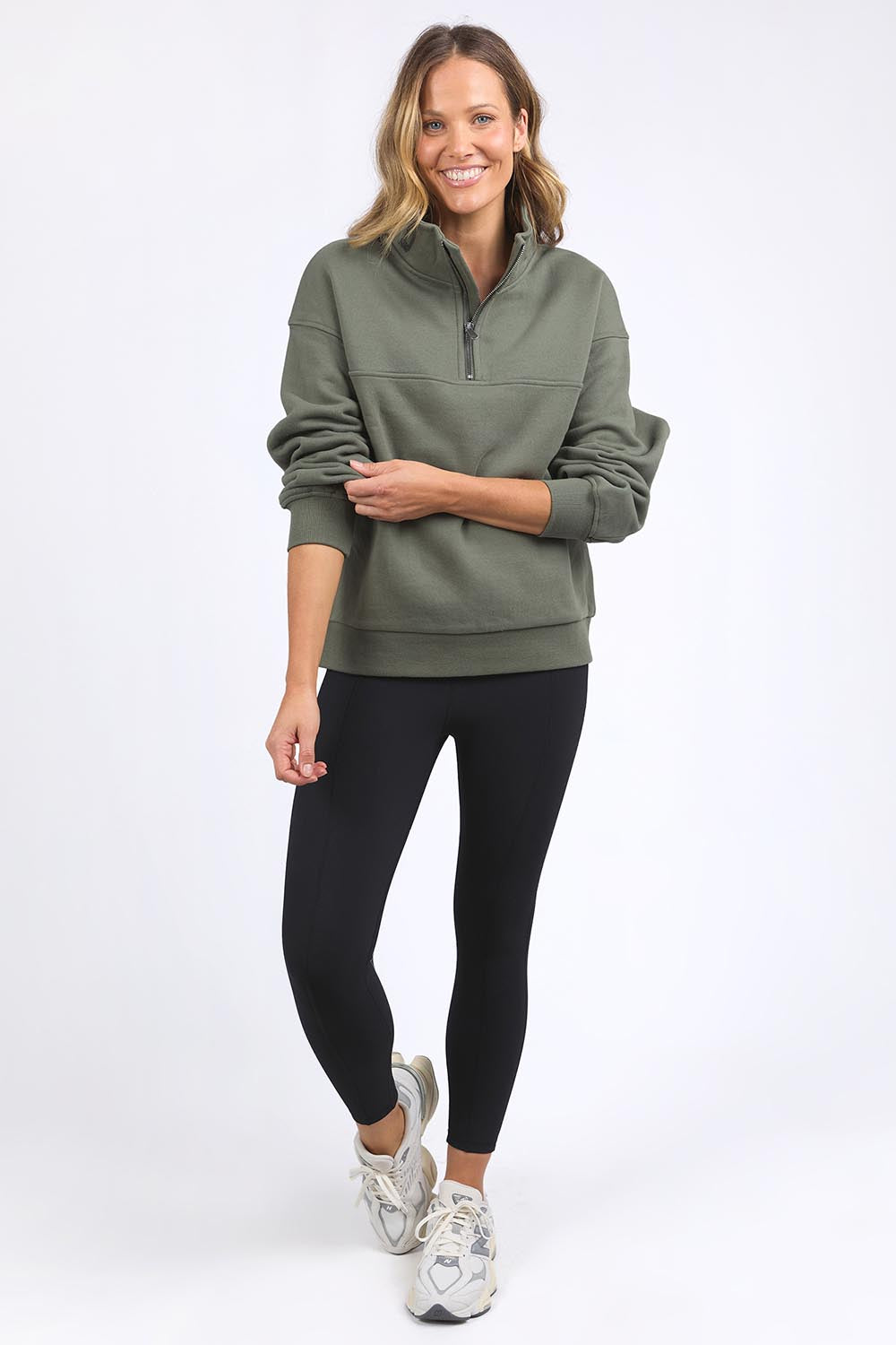 A model wearing the Elements College Zip Crew in colour Khaki (Green), from the front, showing the whole outfit