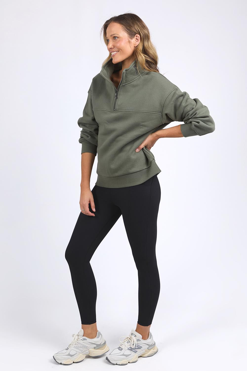 A model wearing the Elements College Zip Crew in colour Khaki (Green), from the front, showing the whole outfit