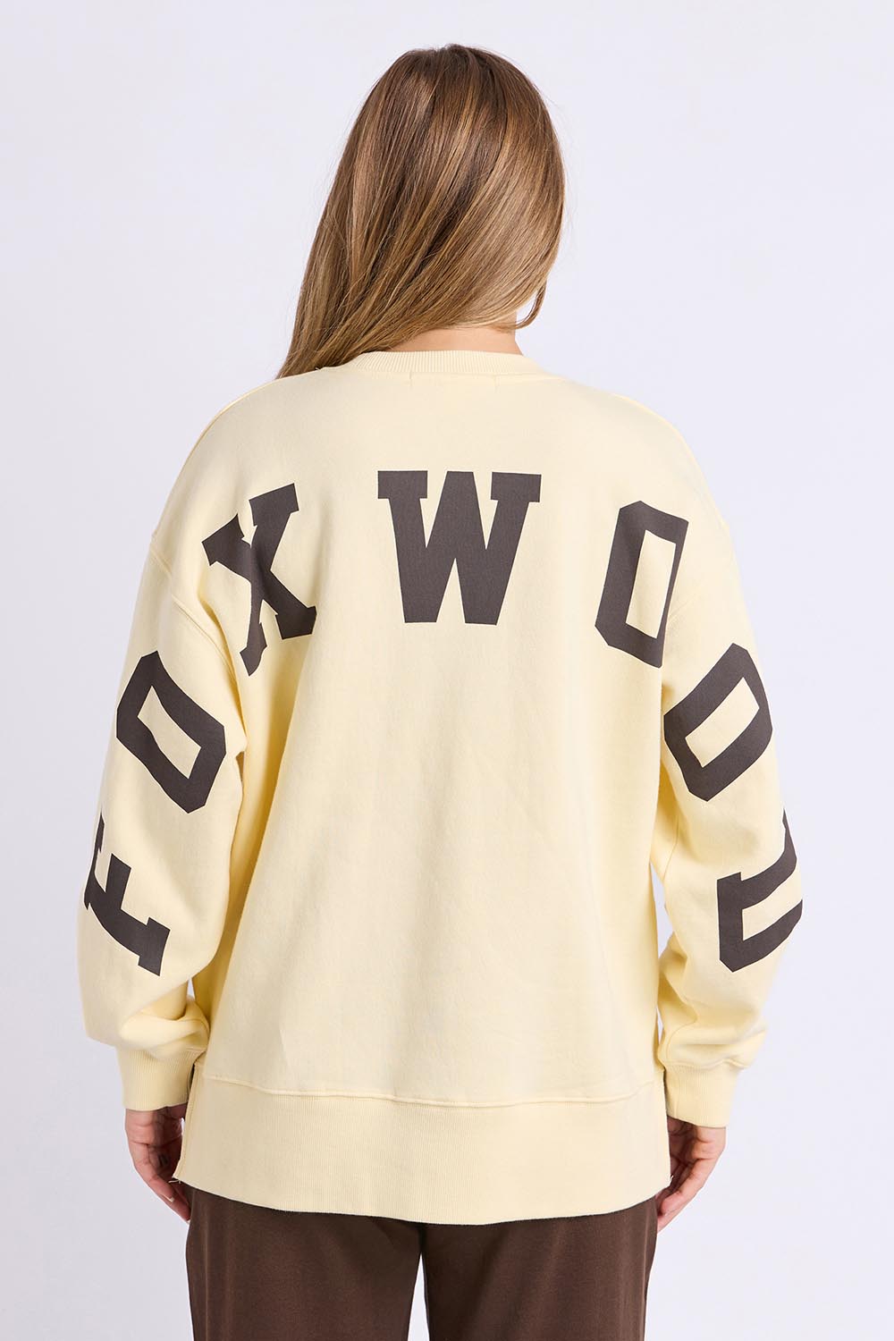 Model Genericm wearing size sample of the Elements Interval Cotton Crew – Buttercrea in colour Buttercrea, from the back