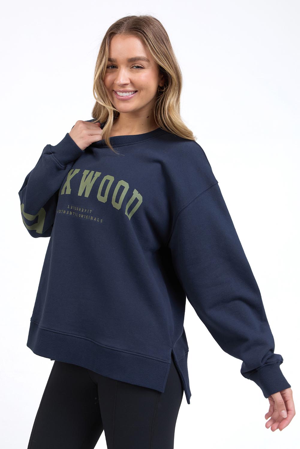 A model wearing the Interval Cotton Crew in colour Navy (Blue), from the front, cropped image