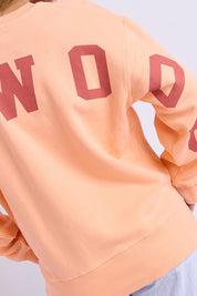 Model Genericm wearing size sample of the Elements Interval Cotton Crew – Neonpeach in colour Neonpeach, from the back