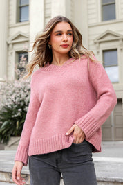 A model wearing the Pepper Knit in colour Rosepink (Pink), from the front, showing the whole outfit