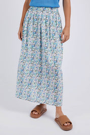 A model wearing the Rosette Floral Skirt in colour Rosette (Blue), from the front, cropped image