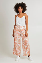 Model Olivia wearing size 10 of the Etched Geo Pant in colour Clay, from the front, showing the whole outfit