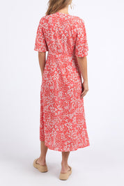 A model wearing the Ankara Dress in colour Red (Red), from the back