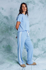 A model wearing the Leisure Power Cotton Pant in colour Blue (Blue), from the front, showing the whole outfit