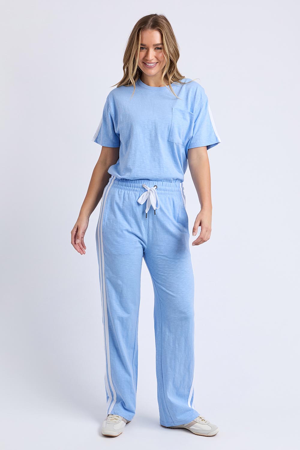 A model wearing the Leisure Power Cotton Pant in colour Blue (Blue), from the front, showing the whole outfit