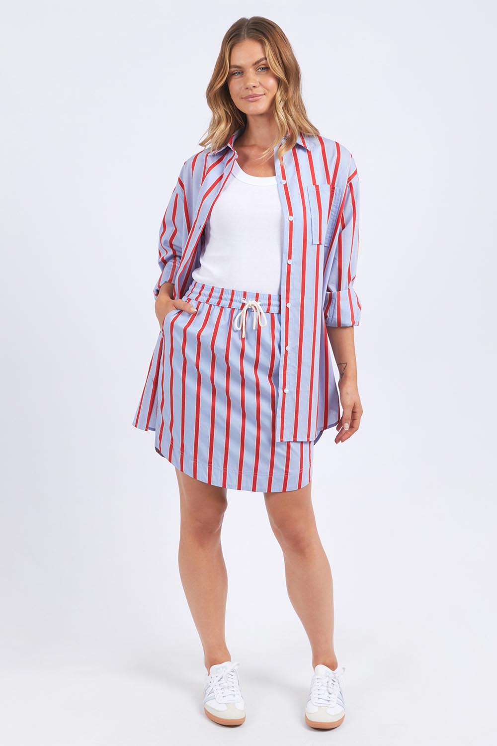 A model wearing the Leisure Stripe Cotton Blend Shirt in colour Bluered (Blue), from the front, showing the whole outfit