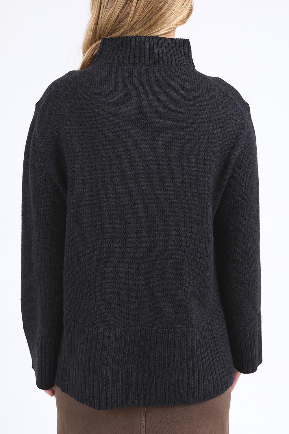 A model wearing the Jude Wool Blend Knit in colour Black (Black), from the back