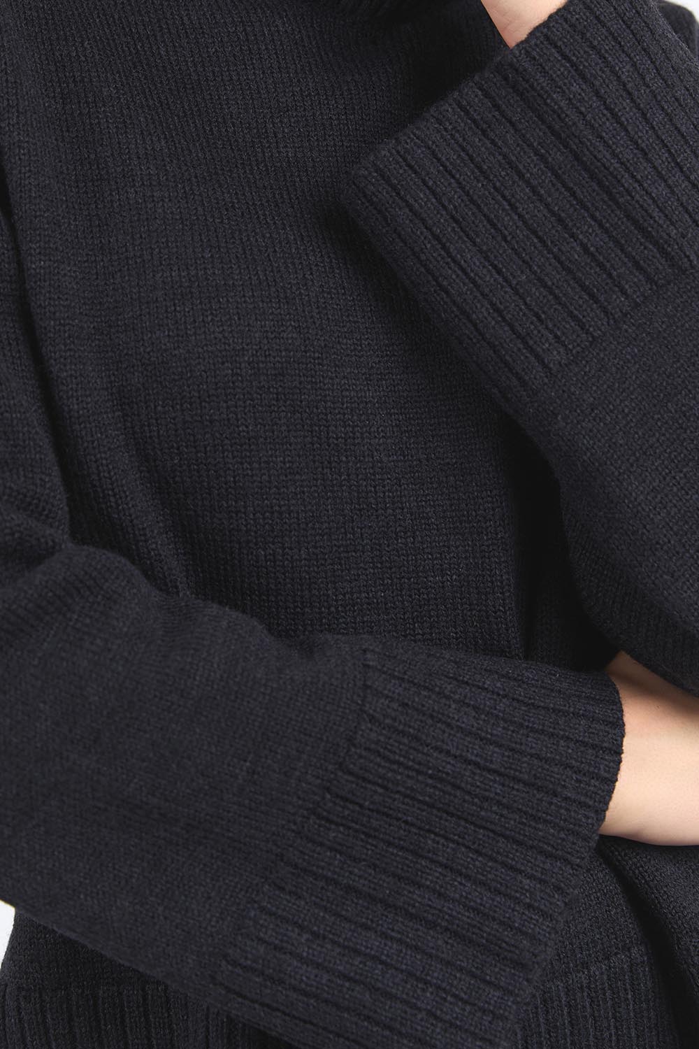 A model wearing the Jude Wool Blend Knit in colour Black (Black), from the front, cropped image