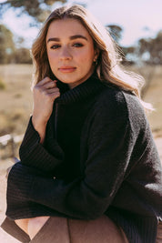 A model wearing the Jude Wool Blend Knit in colour Black (Black), from the front, showing the whole outfit