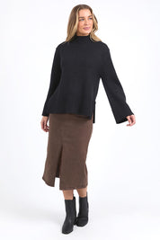 A model wearing the Jude Wool Blend Knit in colour Black (Black), from the front, showing the whole outfit