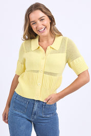 A model wearing the Trevi Cotton Knit Top in colour Lemon, from the front, cropped image