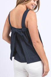 A model wearing the Lourdes Linen Blend Top in colour Navy (Blue), from the back