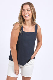 A model wearing the Lourdes Linen Blend Top in colour Navy (Blue), from the front, cropped image