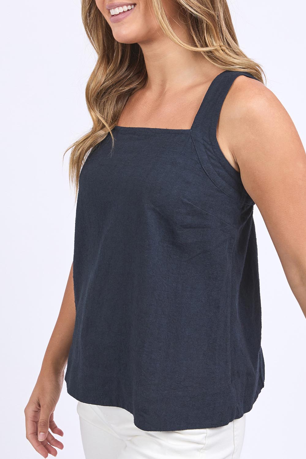 A model wearing the Lourdes Linen Blend Top in colour Navy (Blue), from the front, cropped image