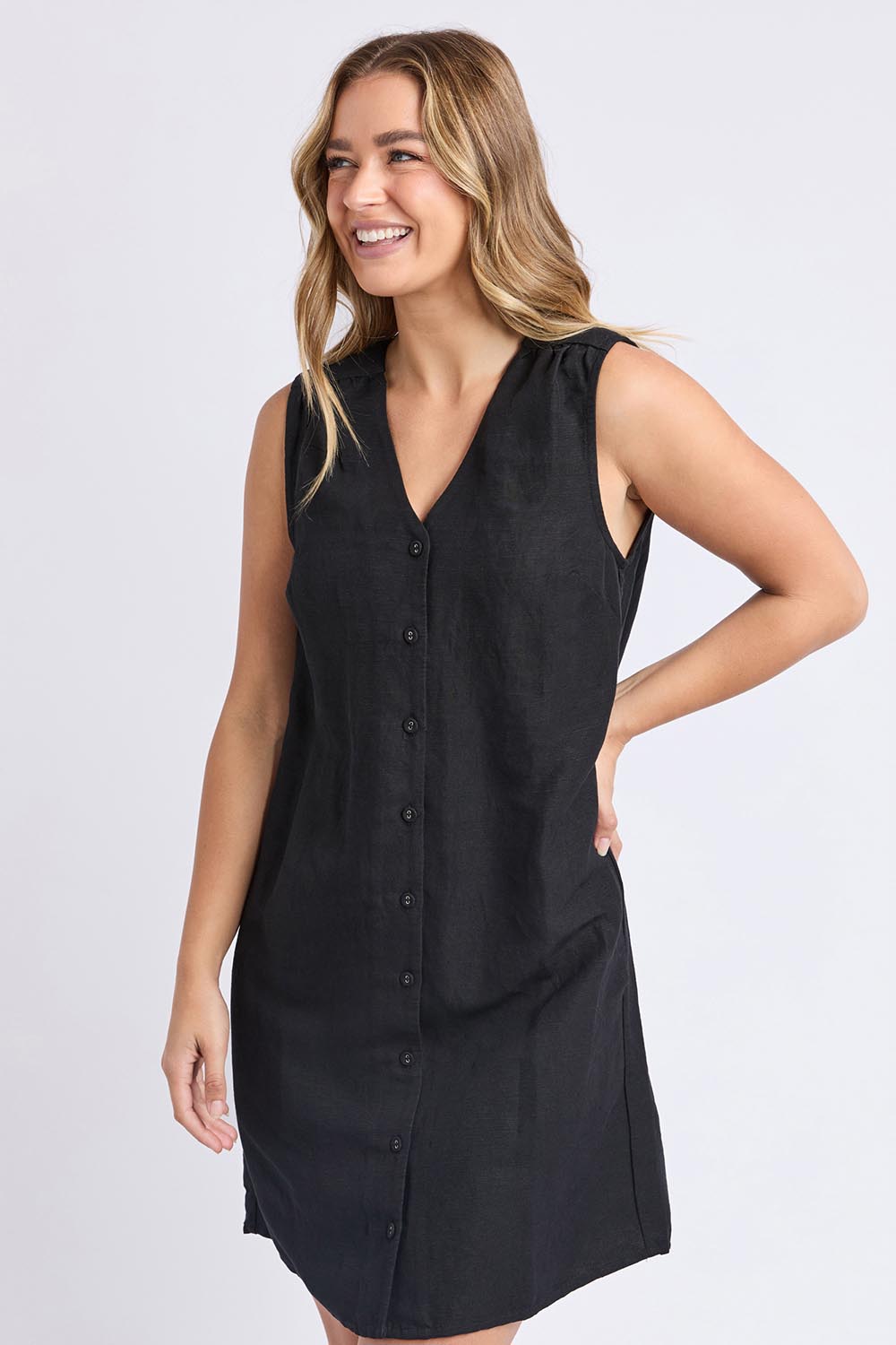 A model wearing the Anara Linen Blend Dress in colour Black (Black), from the front, cropped image