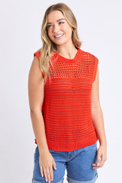 A model wearing the Chilli Cotton Knit Top in colour Tangelo, from the front, cropped image