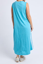 A model wearing the Recovery Cotton Tank Dress in colour Sky (Blue), from the back