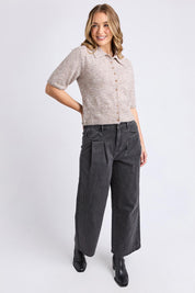 A model wearing the Fernie Button Knit in colour Oatmeal, from the front, showing the whole outfit
