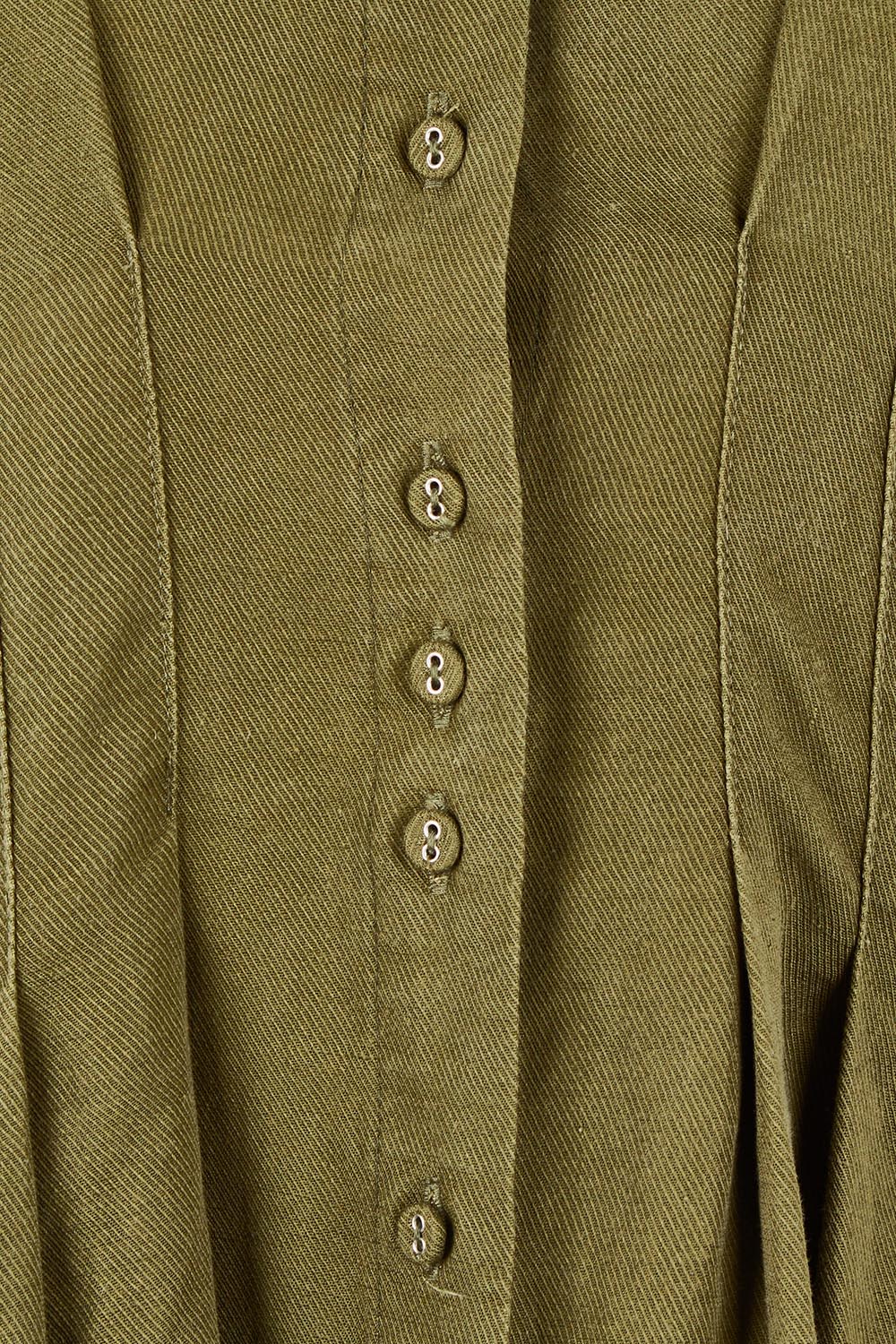 Product shot of the Marbella Dress in colour Wintermoss (Green), detail