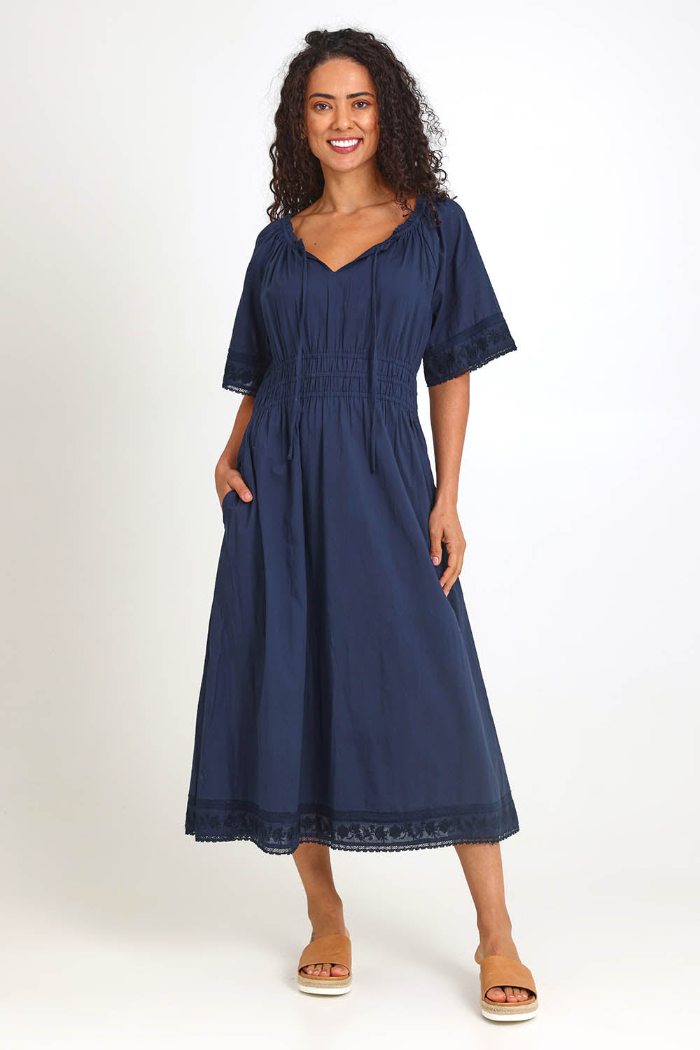 Model Pamelar wearing size 10 of the Juna Dress – Dsapphire in colour Dsapphire, from the front