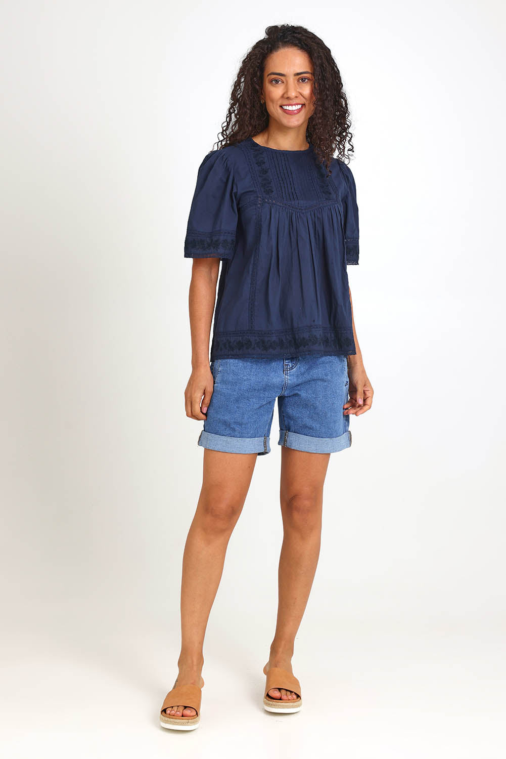 Model Pamelar wearing size 10 of the Juna Top – Dsapphire in colour Dsapphire, from the front
